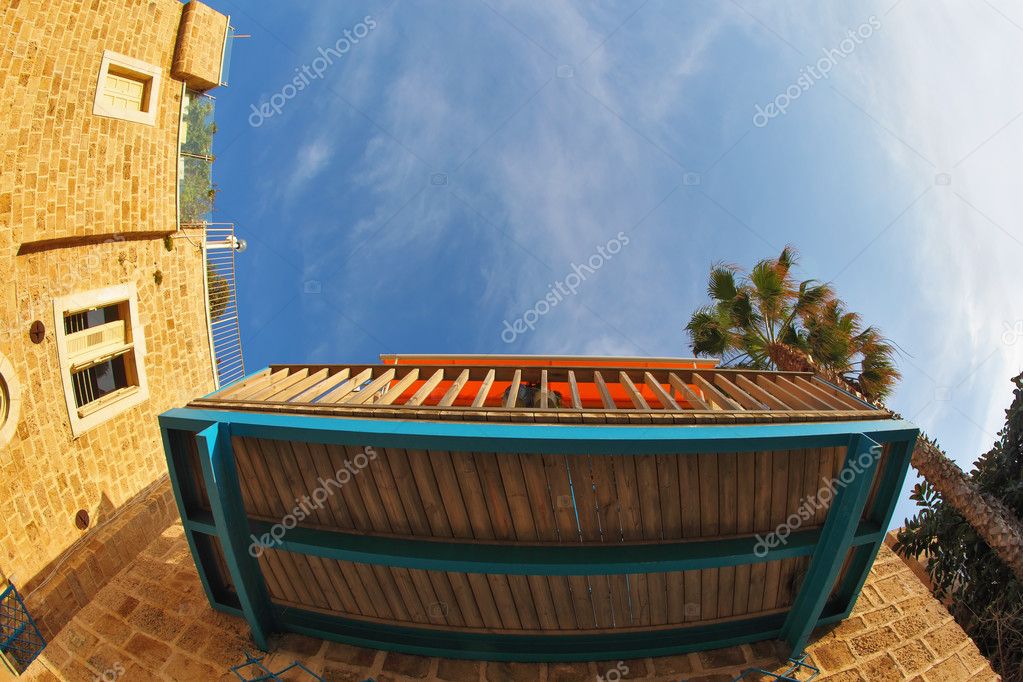 Balcony and window of the ancient house, in lens "fish eye" .