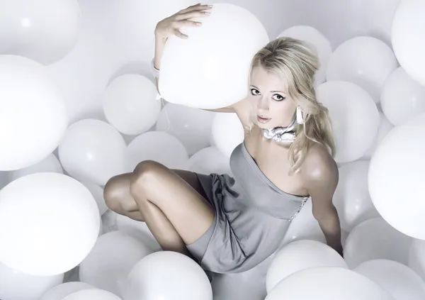 Glamour girl with white balloons