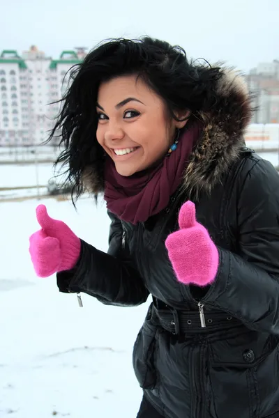 Positive young girl in pink gloves