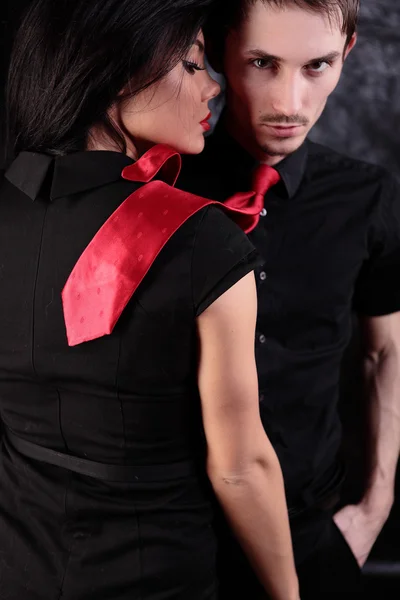 Man with red tie and girl with red lips