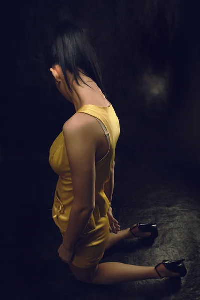 Beauty brunet girl in yellow dress