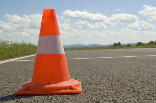Cone on a road.