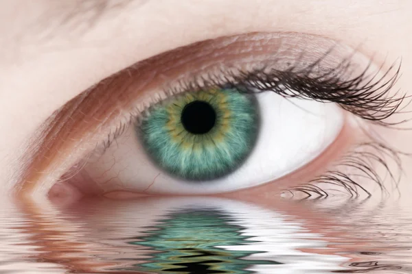 Green human eye reflected