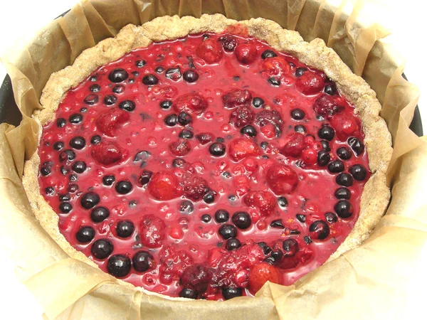 Unbaked berry cake in baking pan with ba