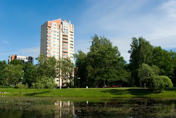 City park with modern residential houses