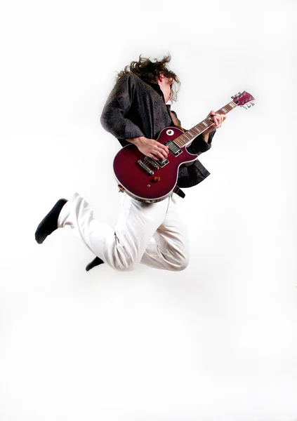 Guitarist playing the guitar in jump