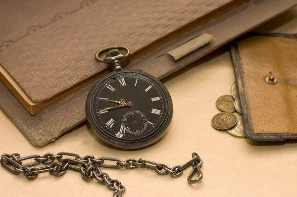 The old book, old watch and money