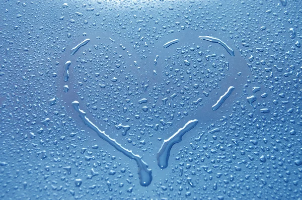 Heart between water drops
