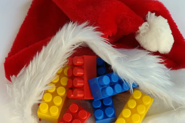 Building blocks on Santa Claus cap