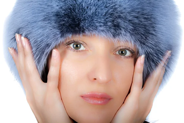 Seductive mature brunette in fur cap by Andrey Turchaninov Stock Photo
