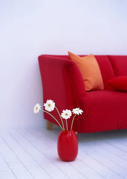 Red sofa and white brick wall