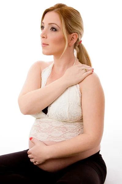 Side pose of blonde pregnant female by Ribkov Dagim Stock Photo