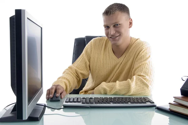 Smiling man working on computer