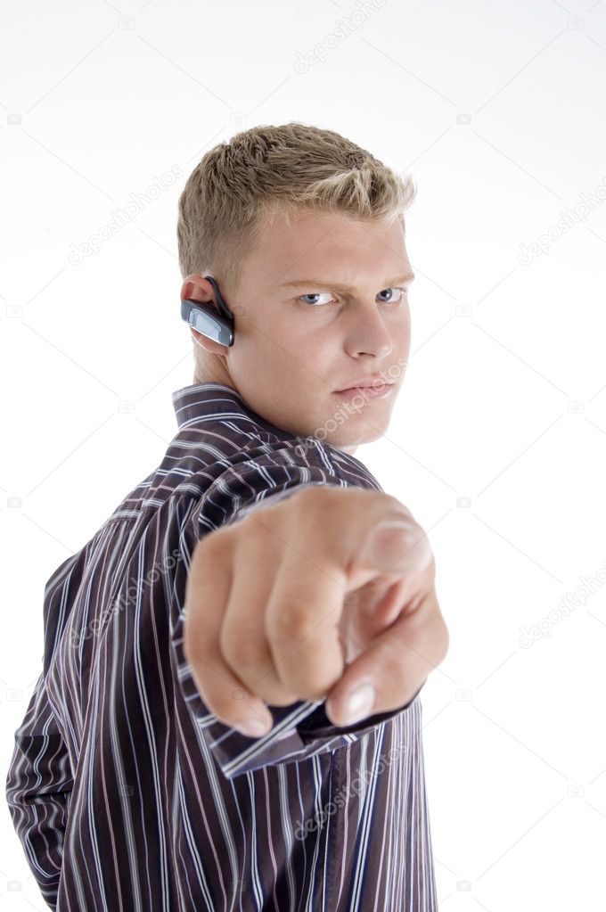 Professional caucasian guy pointing against white background