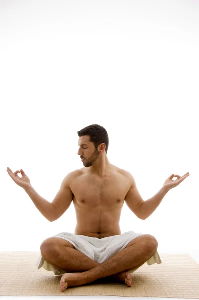 Young man in yoga pose