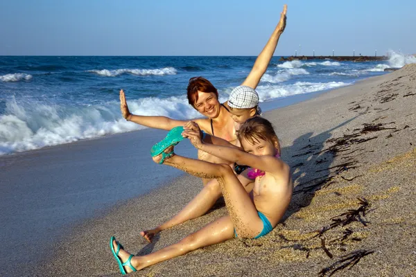Mum with children on a beach