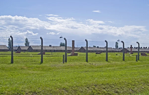 Wire fence and barracks in Birkenau