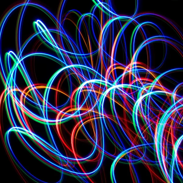 Chaotic colorful lights on a black background