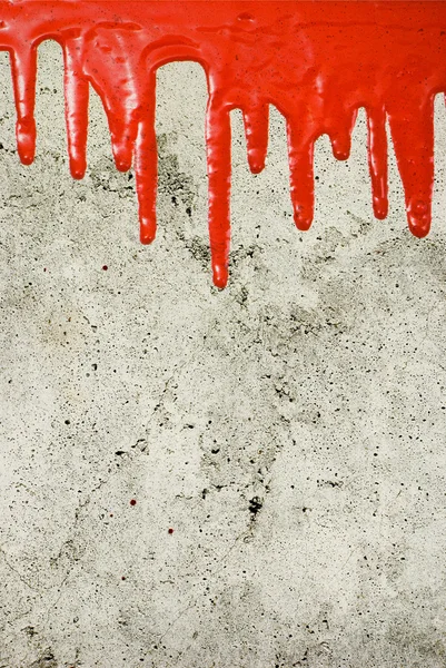 Red paint pouring on vintage background