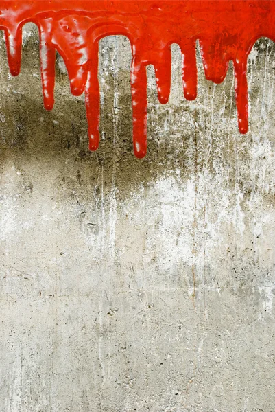 Red paint pouring on vintage wall