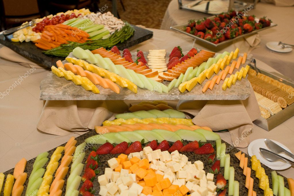  at the buffet table for a wedding reception Trays of fruit cheese 