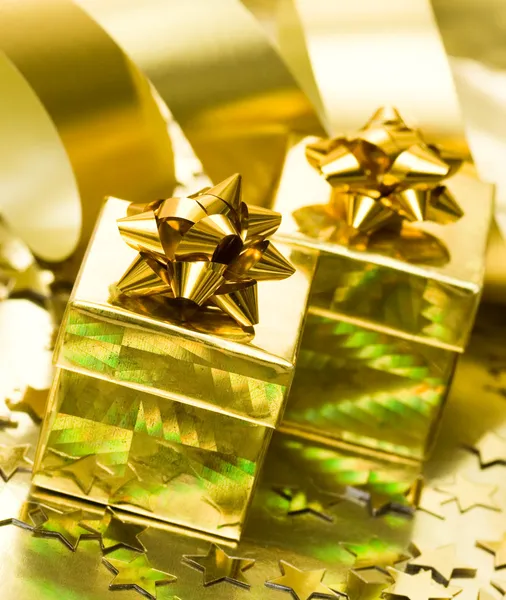 Golden gift boxes with ribbon
