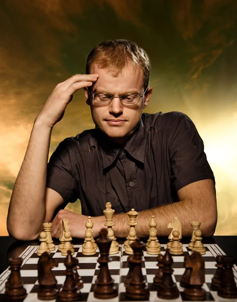 Man playing chess against computer - Stock Image - Everypixel