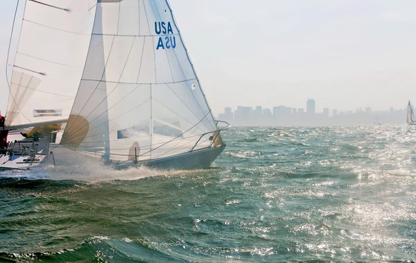 A sailboat racing on the bay