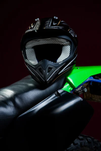 Portrait of helmet laying on motorcycle