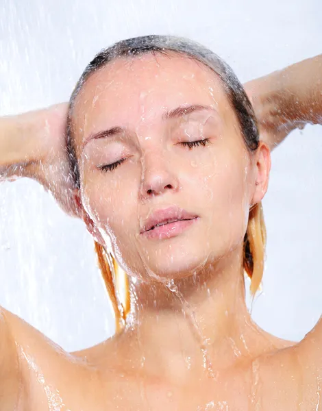 young woman taking shower