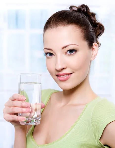 Beautiful woman with glass of water