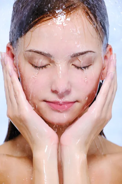 Streams of water on the female face
