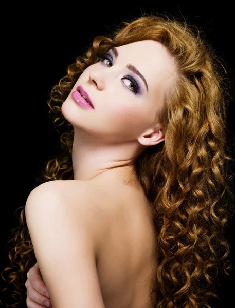 Beautiful woman with long curly hairs