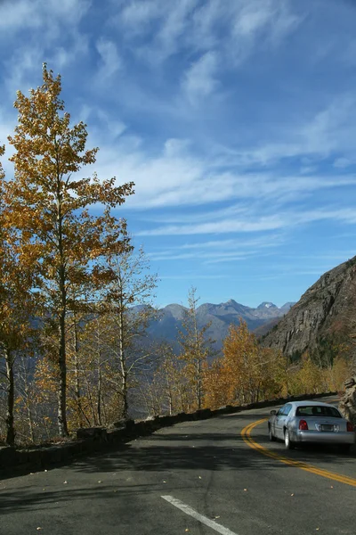 Car on narrow, twisty mountain road