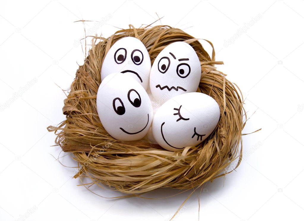 Funny Easter eggs painted with a person lying in the nest