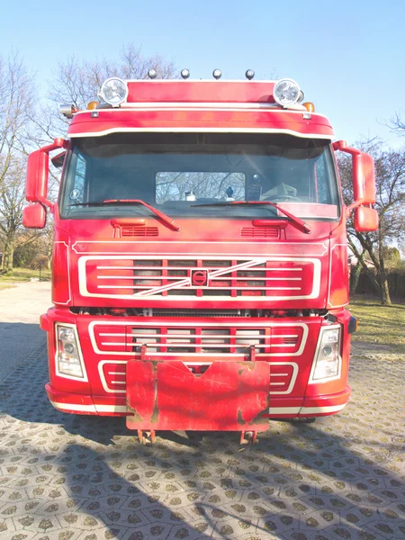 Front view of a red truck in urban area