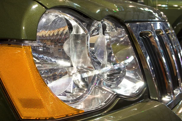 Close-up of a new modern car head lamp