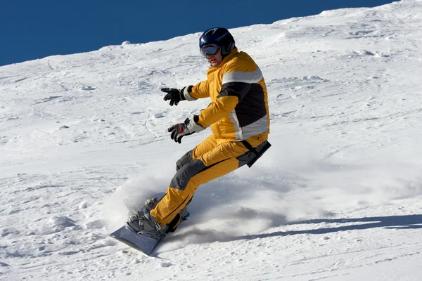 Snowboard in yellow suite