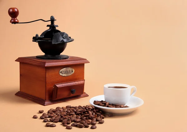 Coffee grinder and cup with coffee — Stock Photo #1503069