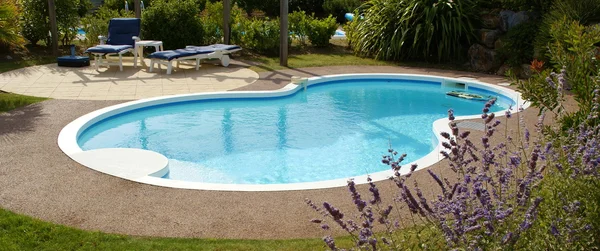 Private swimming pool in garden