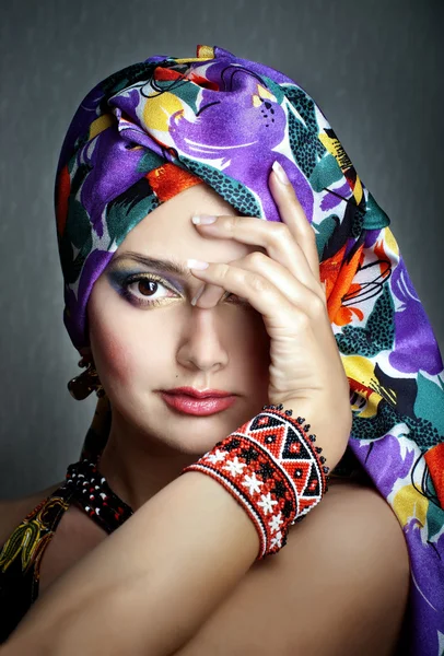 Beautiful young woman in ethnic clothes