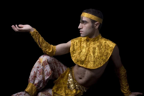 Man in yellow belly dancing