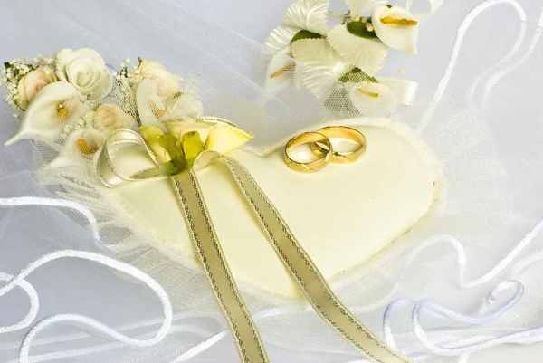 Wedding rings and flowers over veil by Desislava Vasileva Stock Photo