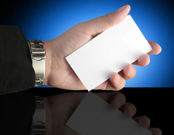 Hand holding blank presentation card