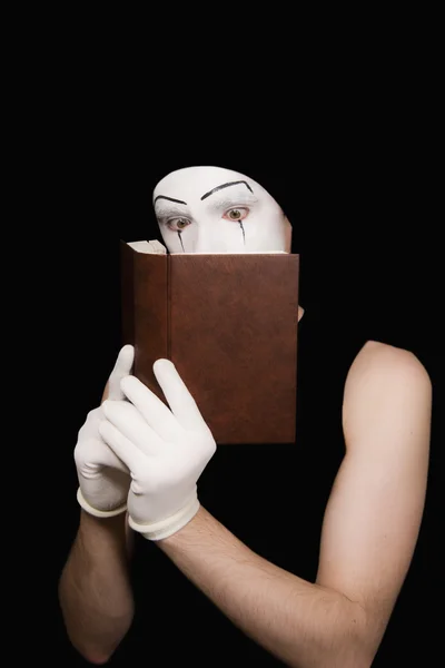 Portrait of mime in white gloves with t