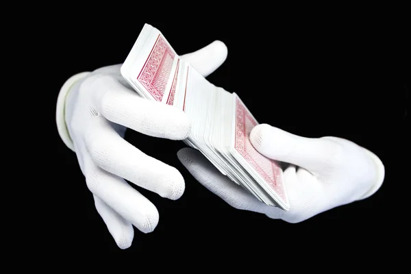 Hands in white gloves with playing card