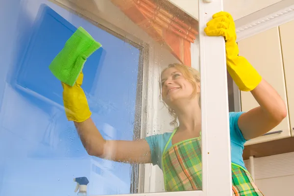 Women cleaning a window 4