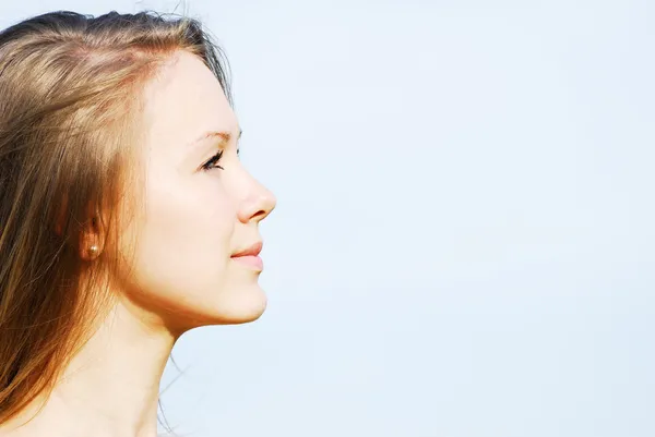 Profile of the face of the young woman