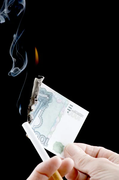 Burning money and cigarette