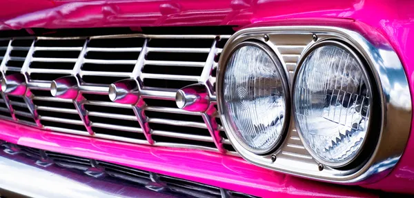 Close-up of car grill (pink Caddie)
